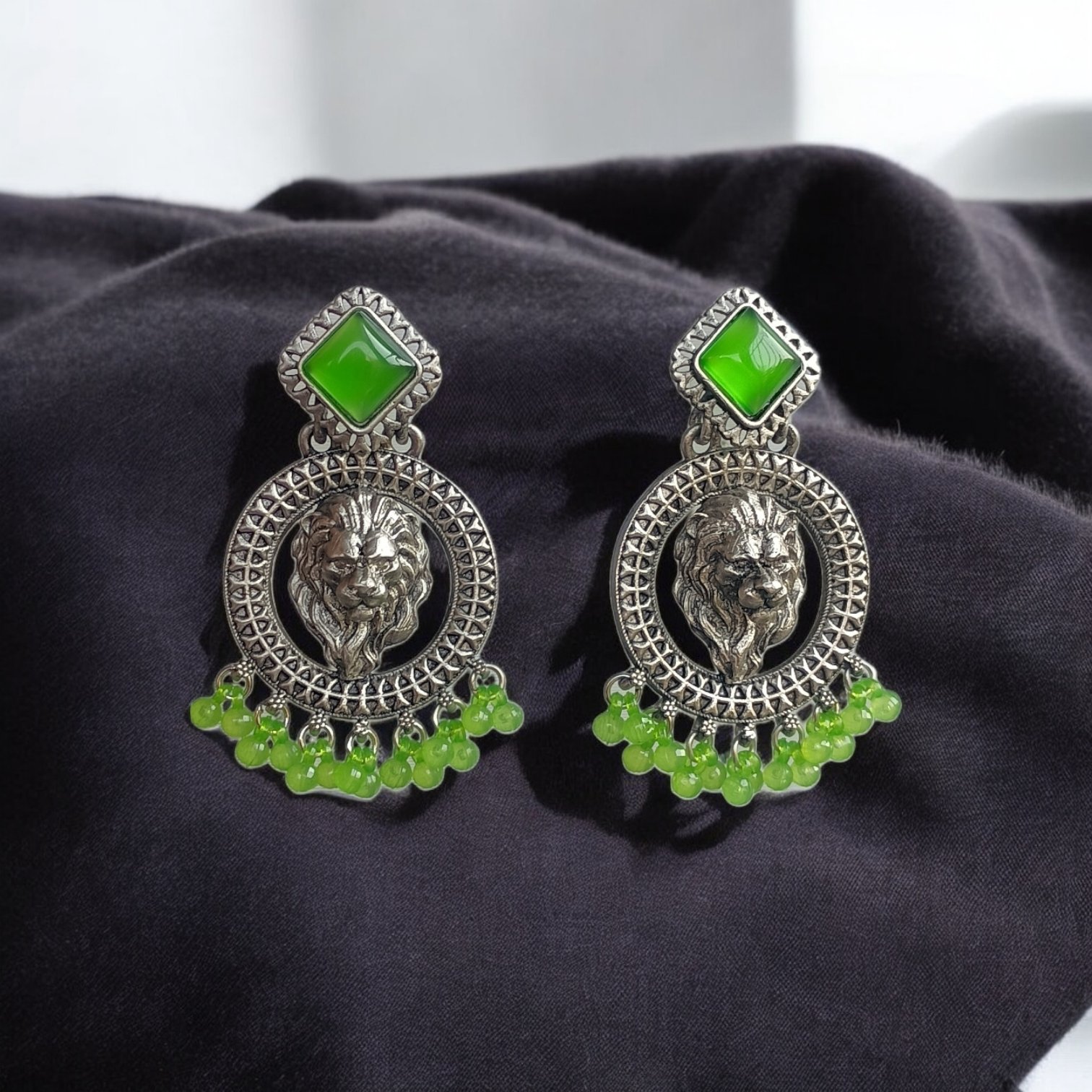 Fierce Lion Head Dangler with Emerald Green Accents